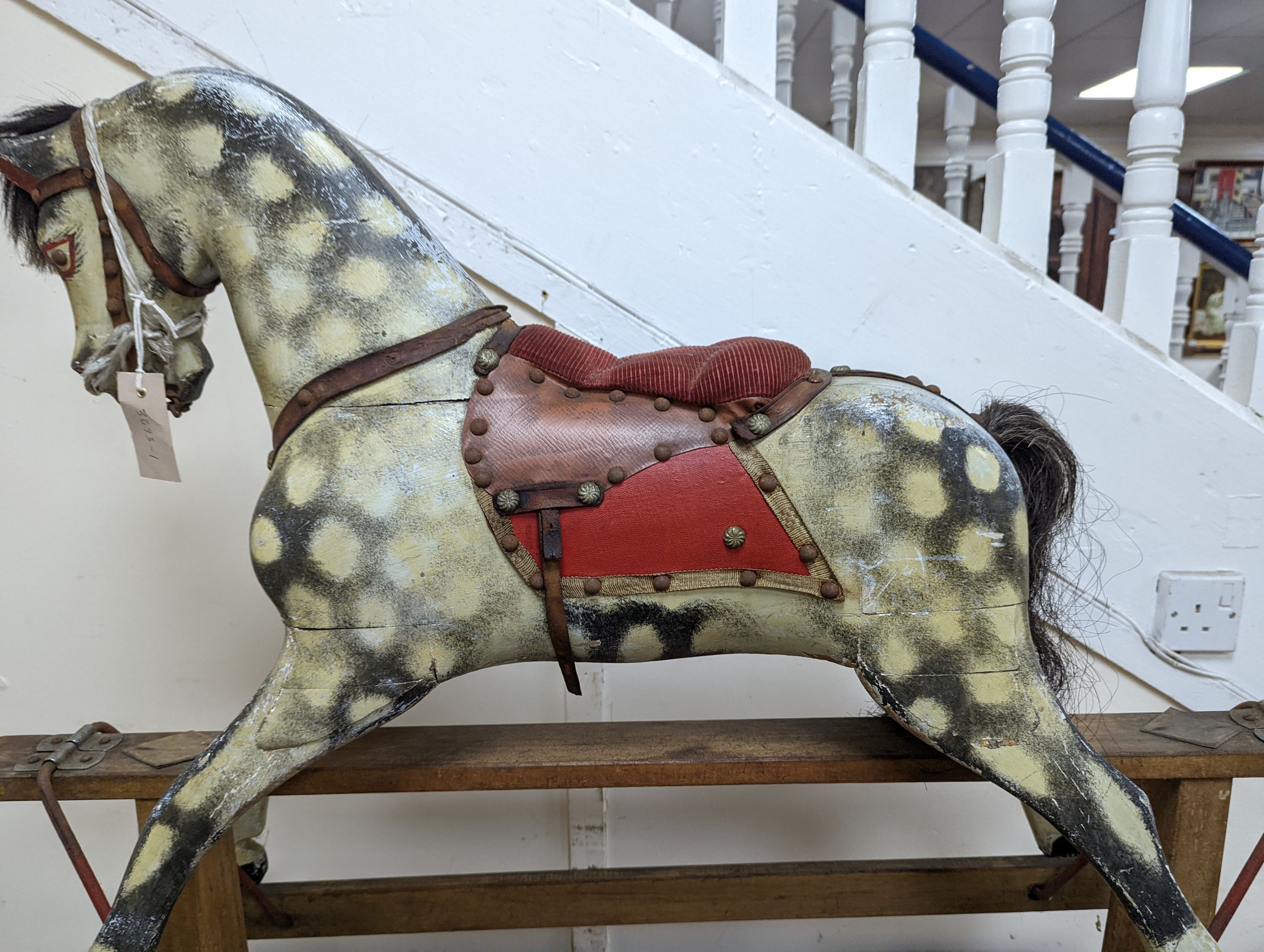 A small early 20th century Ayres type dapple grey rocking horse, length 106cm, height 87cm